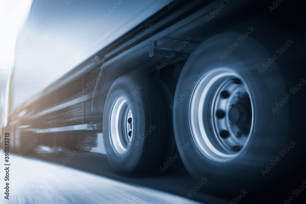 Speed blur motion of semi trailer truck driving on road. trucks loistics. Cargo freight truck transportation. Speed blur motion of semi trailer truck driving on road. trucks loistics. Cargo freight truck transportation.