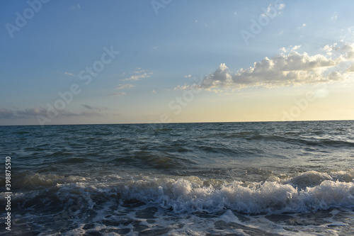 waves on the sea and yellow sky photo