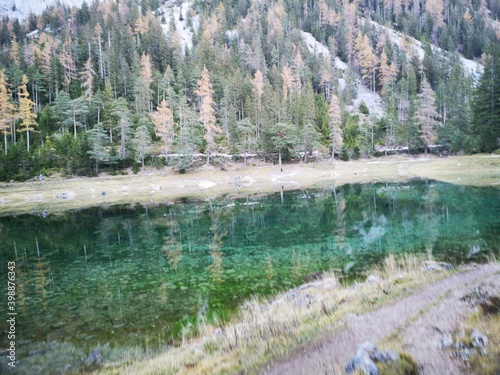 Grüner See Tragöß mit beeindruckender Spiegelung im Abendlicht photo