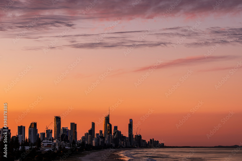 Colourful sunset sky, view from Miami hill lookout with Surfers Paradise Gold Coast cityscape in the horizon