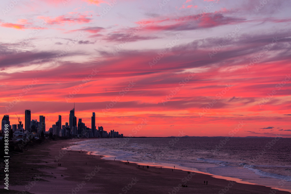 Colourful sunset sky, view from Miami hill lookout with Surfers Paradise Gold Coast cityscape in the horizon