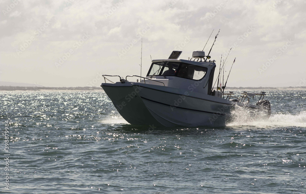 Fishing boat arriving from the sea, after a fishing trip Fishing boat arriving from the sea, after a fishing trip
