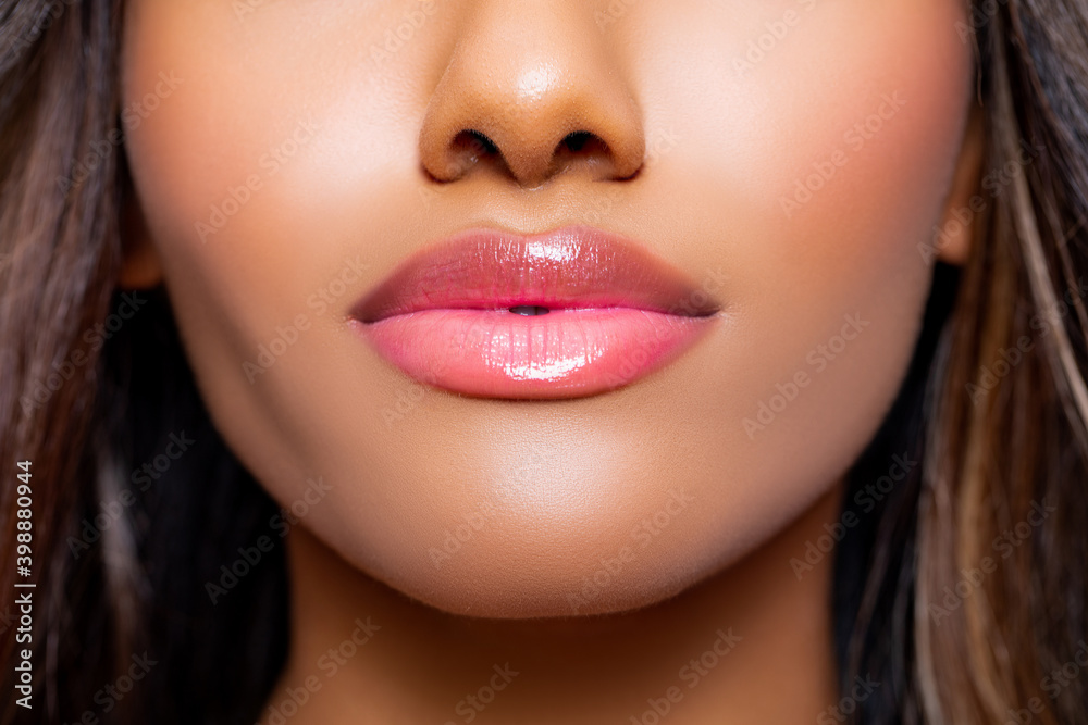 Sexy lips. Beauty Porter young Dark Skinned Girl with perfect Makeup and puffy lips. Bridal makeup delicate Pink tones, Wet make-up, shine. Vivid Pink makeup. Beauty. fashionable Wet make-up   