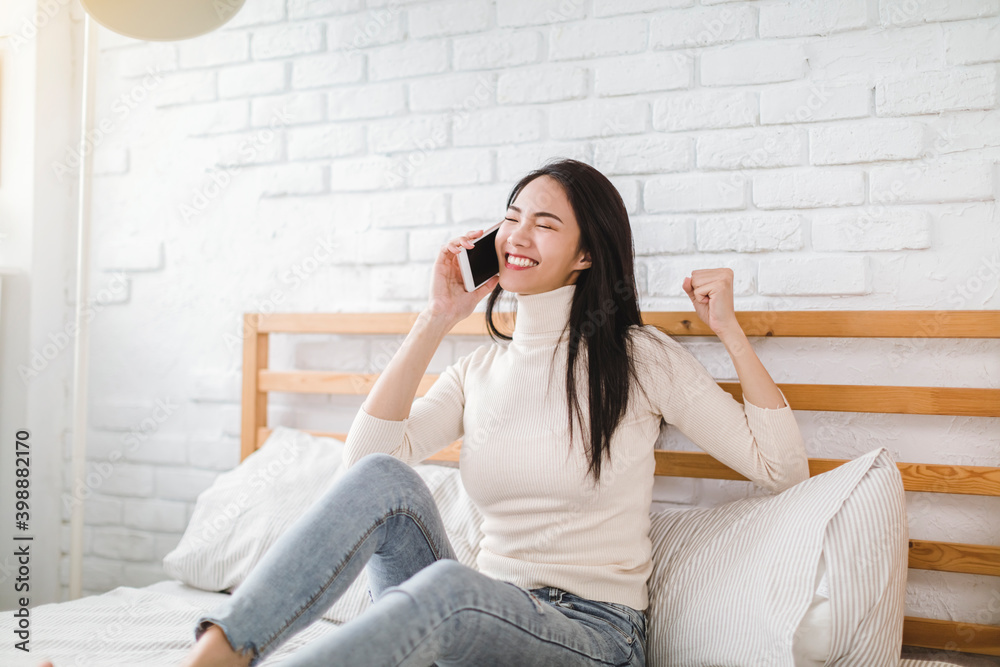 young woman talking with friend on mobile phone and laughing young woman talking with friend on mobile phone and laughing
