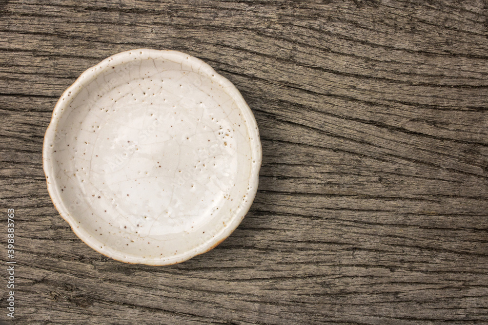 handmade ceramic coasters on rustic wooden table. handmade ceramic coasters on rustic wooden table.