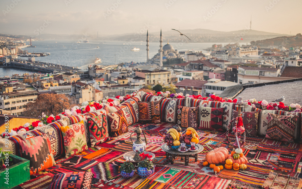 Fototapeta premium Great panoramic view of Istanbul from high terrace decorated traditional colorful ornamental pillows