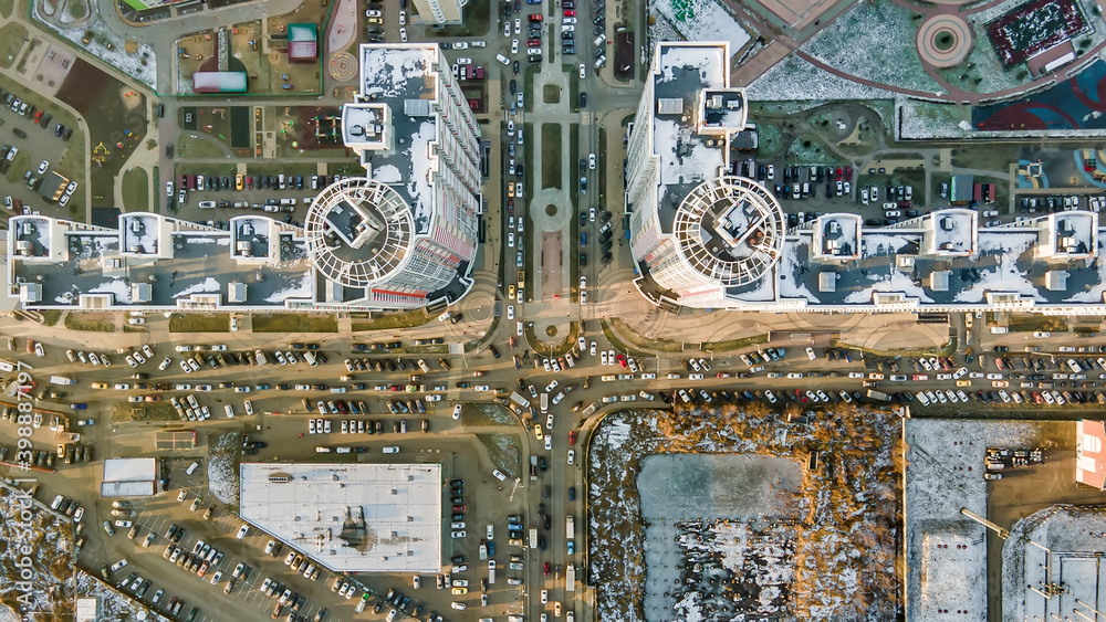 Large intersection in the city block. View of tall houses from a drone. Urban photography.