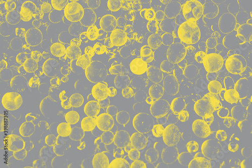 Close up - Pile of silica gel on trendy 2021 new colors. Illuminating Yellow and Ultimate Gray. Color of the Year 2021.Desiccant Silica Gel (Moisture Absorber) Background
