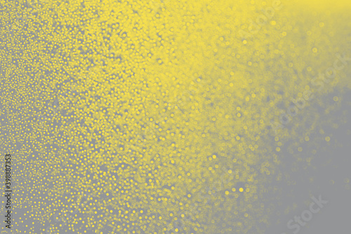 Abstract bokeh background in trendy 2021 new colors. Illuminating Yellow and Ultimate Gray. Color of the Year 2021. Christmas bokeh lights refocused blurred background
