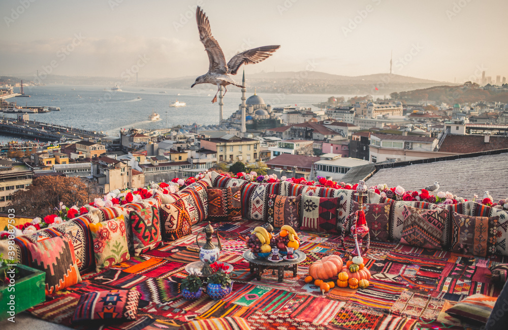 Fototapeta premium Great panoramic view of Istanbul from high terrace decorated traditional colorful ornamental pillows