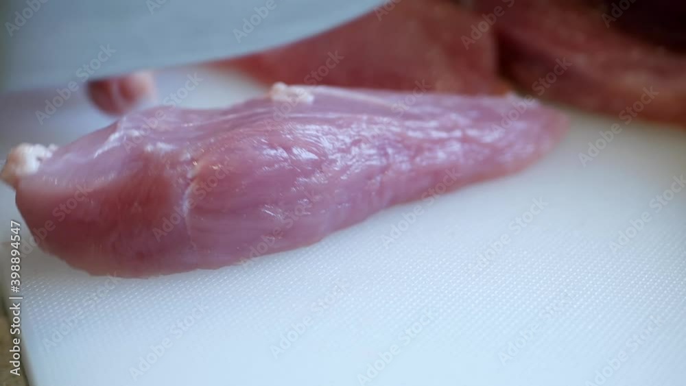 Slice pork meat with a knife Slice pork meat with a knife