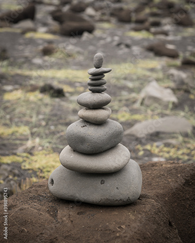 stack of zen pebble stones in balance on the beach