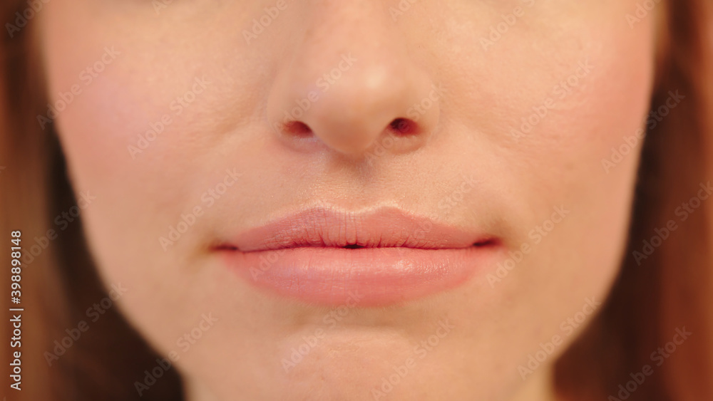 Obraz premium Lips of woman with no lipstic, close up. High quality photo
