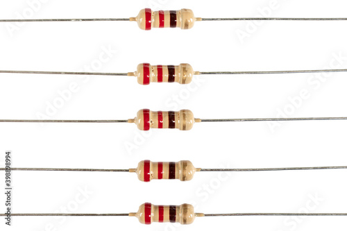 Close up shot of several electronic resistors isolated on white background. Carbon film resistors on white background. Macro shot various electronic components
