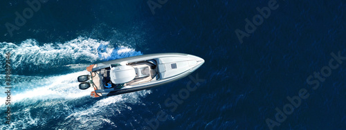 Aerial drone ultra wide panoramic photo of inflatable speed boat cruising in high speed in Mediterranean Aegean sea