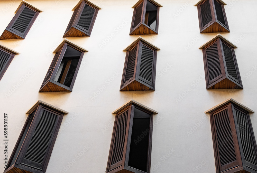 wooden windows in a white facade
