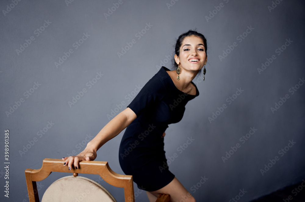 sexy woman indoors near chair model evening dress sexy woman indoors near chair model evening dress