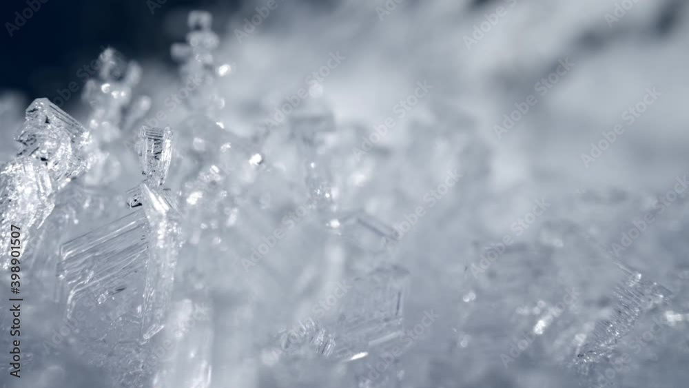 Camera moves through the snow crystals. Transparent snow ice formations background. Real snow frost figures. Winter nature sliding shot. High quality, UHD Camera moves through the snow crystals. Transparent snow ice formations background. Real snow frost figures. Winter nature sliding shot. High quality, UHD