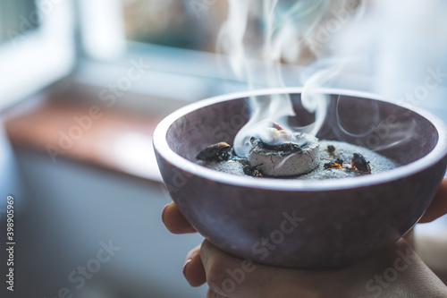 Traditional esoteric incense ritual at New Year and Christmas, smoke for cleaning the house