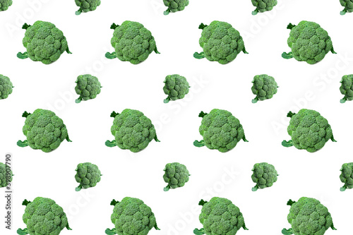 Pattern with green bunchs of broccoli on white background. Vegetable abstract pattern. Broccoli isolated on white background.