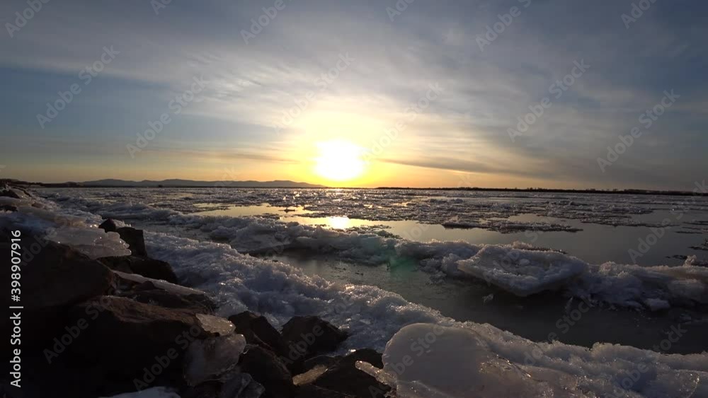 Beautiful sunset on the Amur river. Ice drift Beautiful sunset on the Amur river. Ice drift