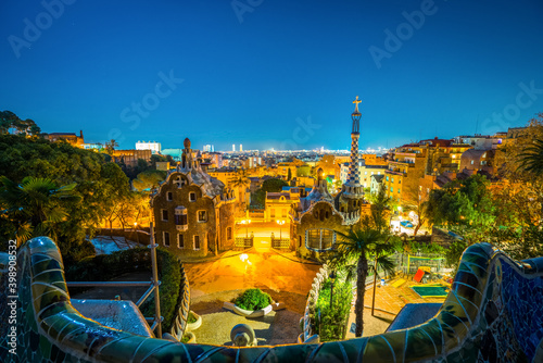 Fototapeta Naklejka Na Ścianę i Meble -  Night time view of Barcelona seen from Park Guell. Park was built from 1900 to 1914 and was officially opened as a public park in 1926. In 1984, UNESCO declared the park a World Heritage Site