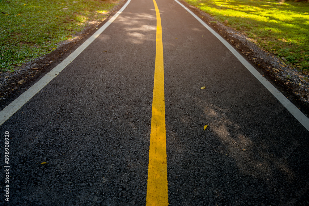 Yellow line on road with sunrise. Start for new business Yellow line on road with sunrise. Start for new business