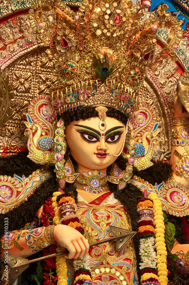 A gorgeous looking divine idol of Hindu Goddess Jagatdhatri / Jagaddhatri inside puja pandal. Shot at Chandannagar, West Bengal where it is a major religious festival.