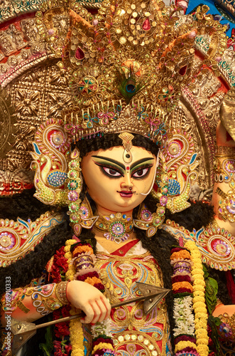 A gorgeous looking divine idol of Hindu Goddess Jagatdhatri / Jagaddhatri inside puja pandal. Shot at Chandannagar, West Bengal where it is a major religious festival. © suprabhat