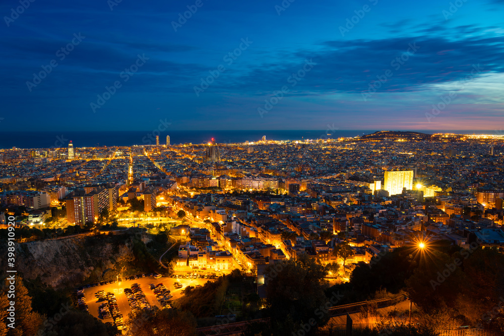 Aerial view of Barcelona city centre at dusk. Spain