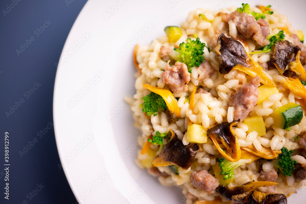 Risotto with vegetables, mushrooms and cheese. Traditional italian recipe. Risotto with vegetables, mushrooms and cheese. Traditional italian recipe.
