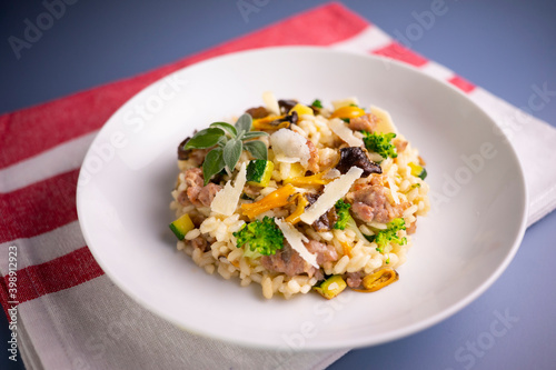 Risotto with vegetables, mushrooms and cheese. Traditional italian recipe. 