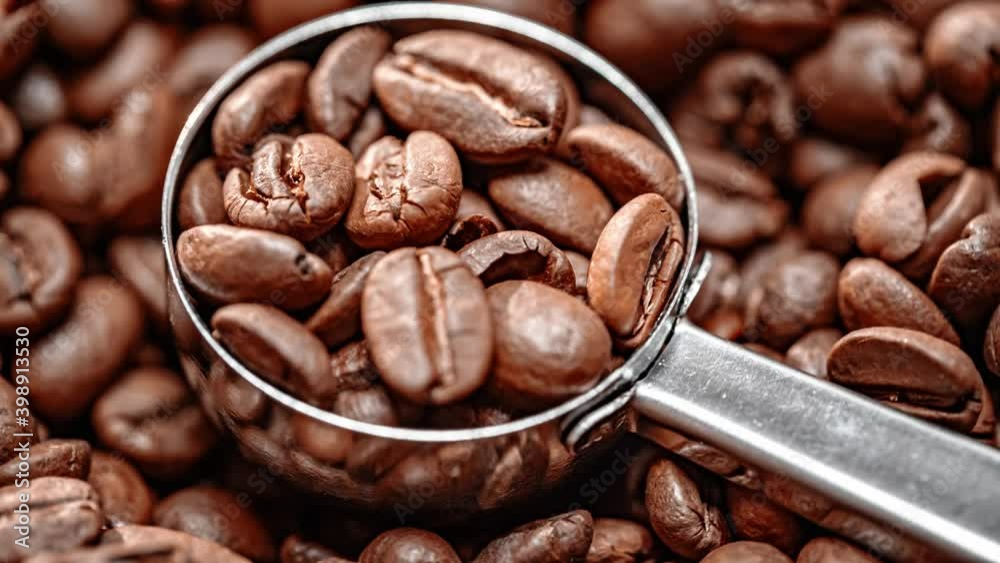 Close up of seeds of coffee. Fragrant coffee beans are roasted smoke comes from coffee beans. Close up of seeds of coffee. Fragrant coffee beans are roasted smoke comes from coffee beans.