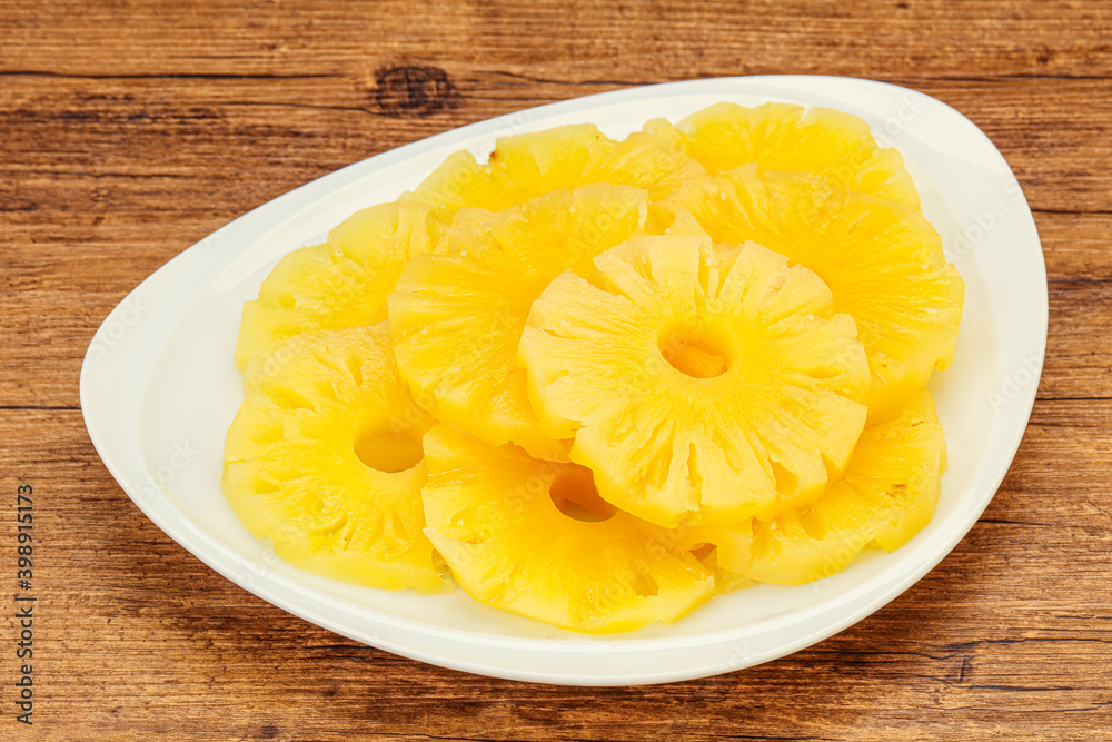 Marinated pineapple rings in the bowl Marinated pineapple rings in the bowl