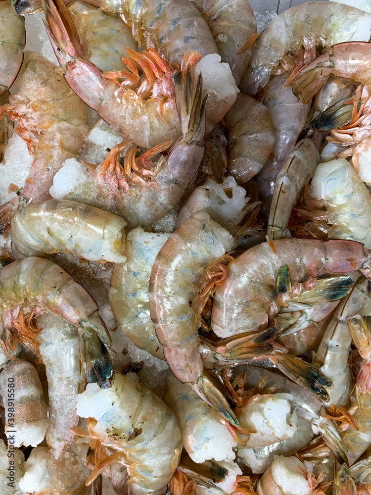 raw headless shrimps on a local fish market