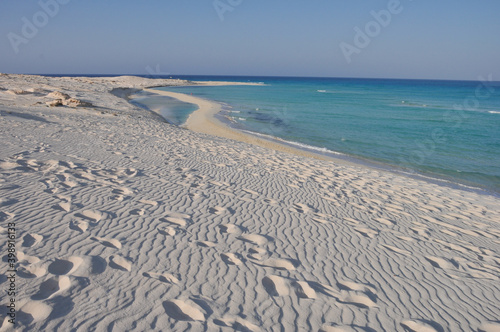 secret white sandy beach with caribic blue sea