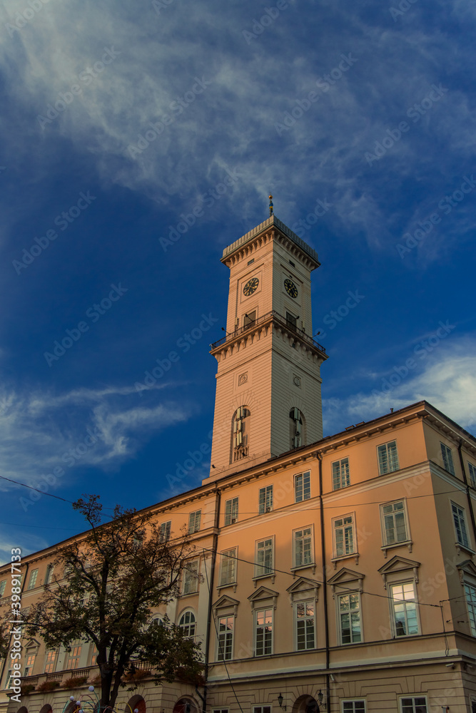 old city town hall architecture building object tower and main campus foreshortening from below vertical picture format in spring morning clear weather time