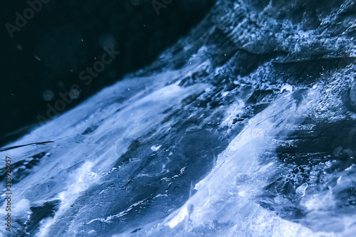 Pattern of crack in ice. Frozen water textured background
