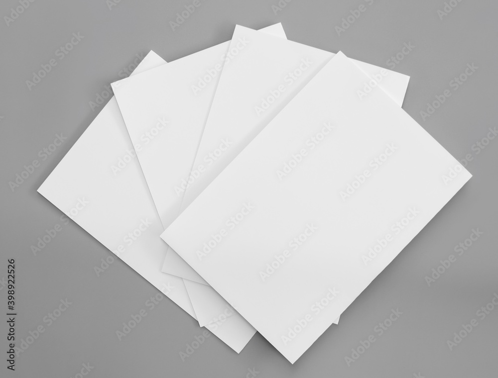 Faake Paper Work White paper mock-ups isolated on gray background, Blank portrait paper ...