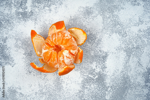Mandarin on light concrete background. Top view, flat lay, copy space. Recipe, diet, nutrition concept.
