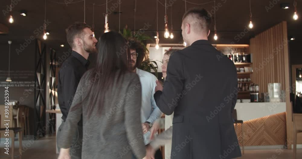 5 friends celebrating in a coffee house 5 friends celebrating in a coffee house