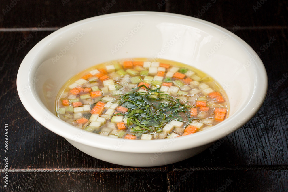 vegetable soup with carrots and zucchini garnished with dill vegetable soup with carrots and zucchini garnished with dill
