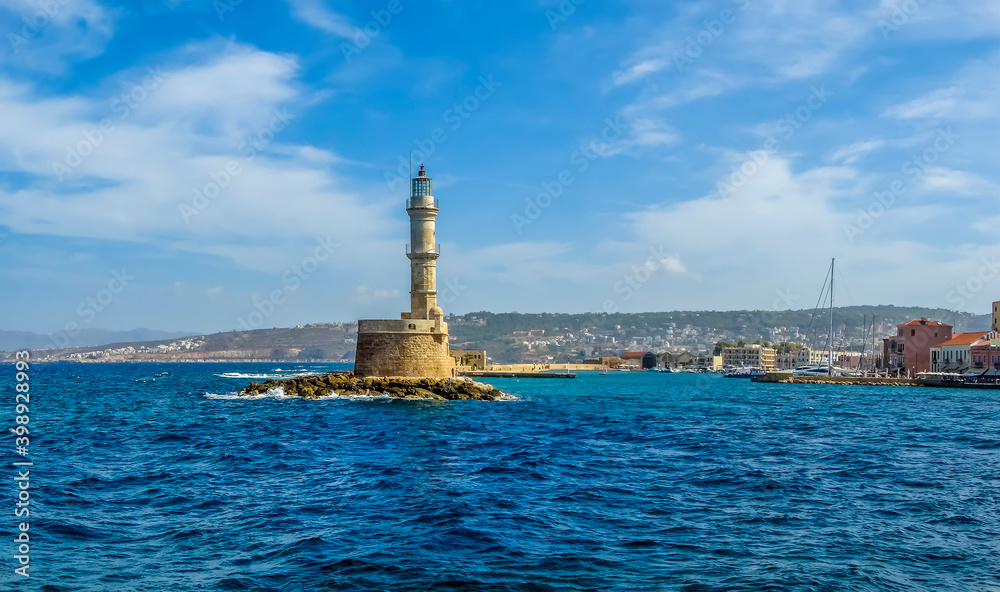 A view of the entrance to the main harbour and marina in Chania, Crete on a bright sunny day