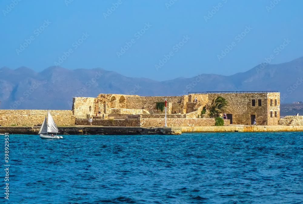 A view of the harbour breakwater defenses in Chania, Crete on a bright sunny day