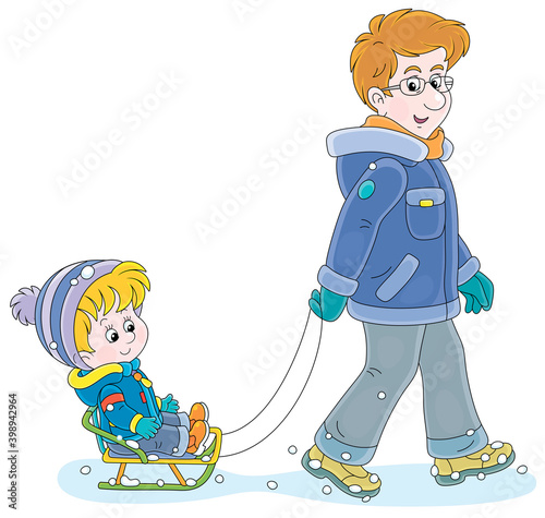 Young dad sledding a happy ...