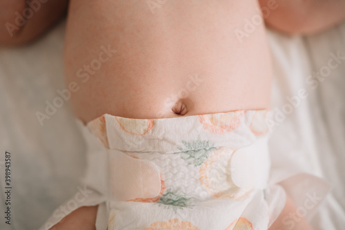 The baby's navel. healthy stomach, a cure for gas in newborns. intestinal colic photo