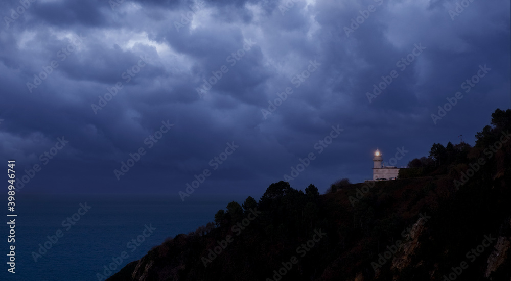 Dark clouds over the Igueldo lighthouse, Euskadi