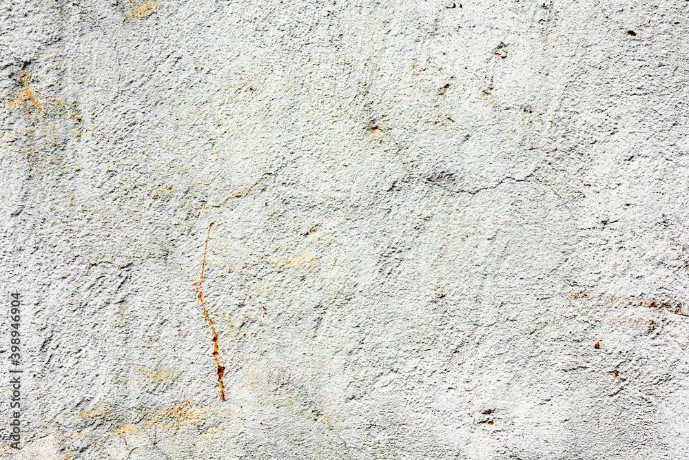 Texture of a concrete wall with cracks and scratches which can be used as a background Texture of a concrete wall with cracks and scratches which can be used as a background