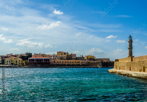 Fototapeta Naklejka Na Ścianę i Meble -  The entrance to Chania harbour, Crete on a bright sunny day