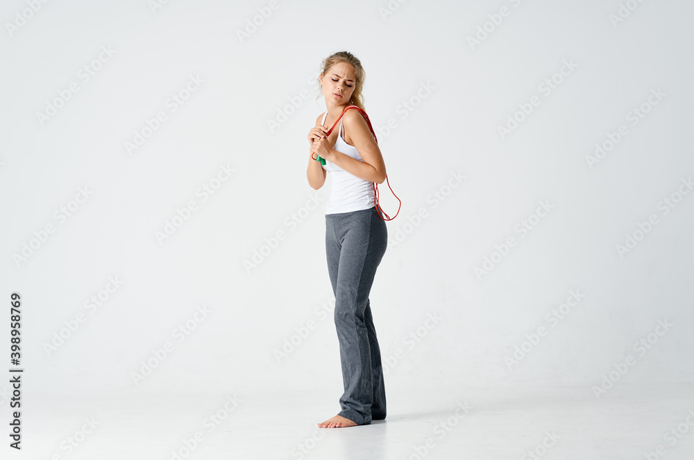 woman with skipping rope sport fitness slim figure sweatpants woman with skipping rope sport fitness slim figure sweatpants